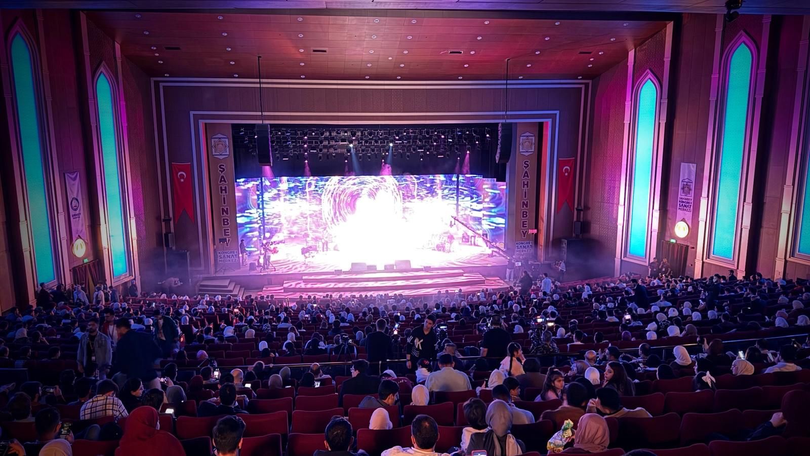 A full auditorium before a public talk